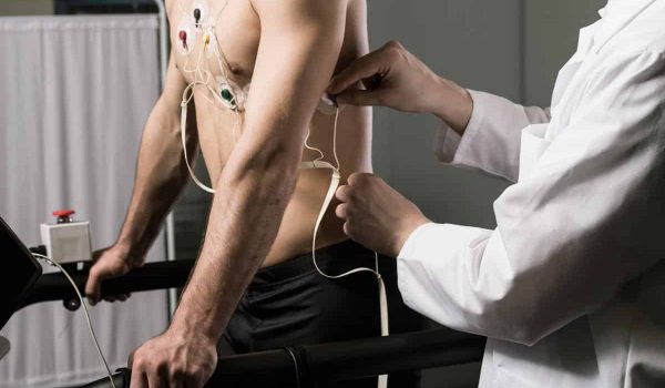 Athletic man with cardiogram electrodes Athletic man with cardiogram electrodes